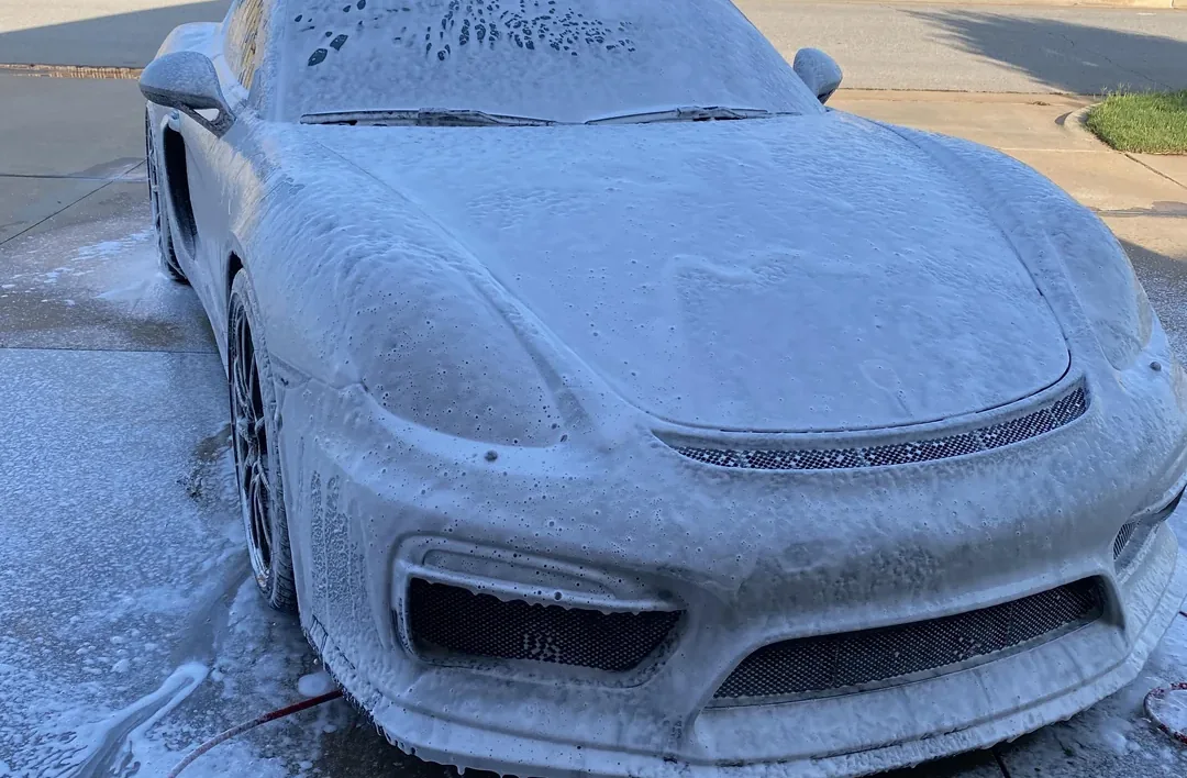 Hand washing the exterior of a car, wheels and paint